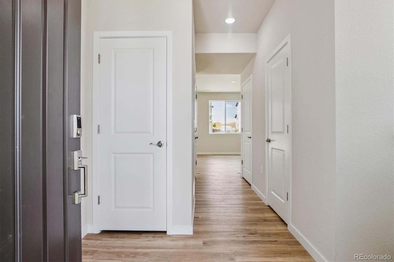42591 Kinloch Trail Elizabeth, CO 80107 - Photo 10 of 21 a view of a hallway with wooden floor