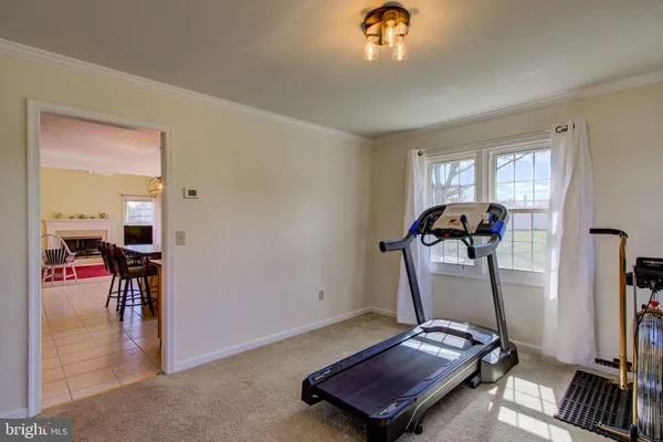 a view of room with gym equipment