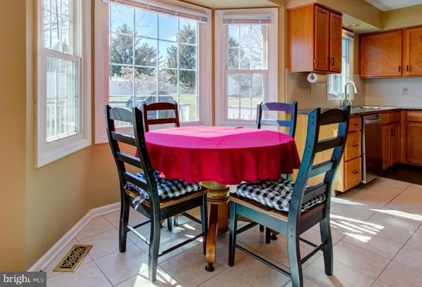 a living room with furniture kitchen view and a kitchen view