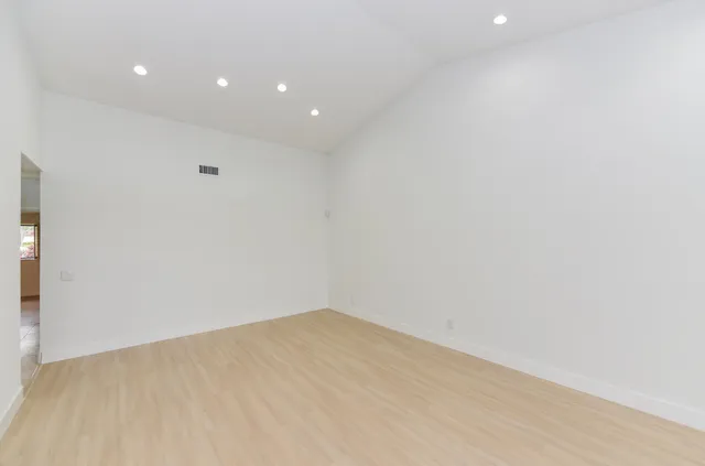 an empty room with windows and view