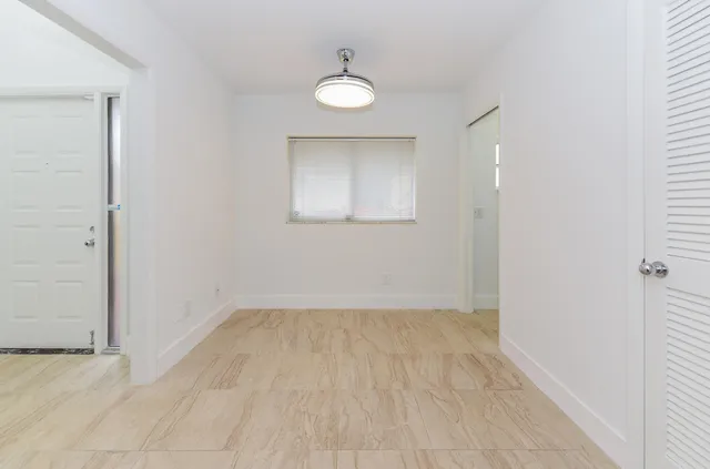 a white toilet sitting next to a white sink