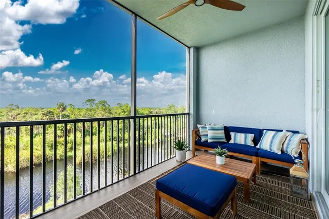 a balcony with chairs and a table