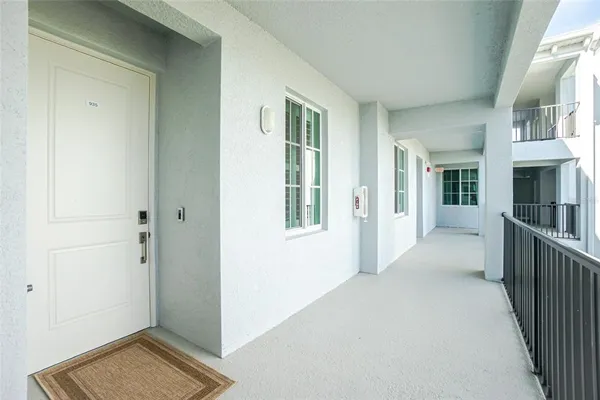 a kitchen with stainless steel appliances a refrigerator a stove a sink a stove a dining table and chairs