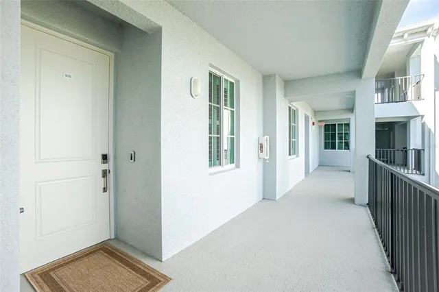 a kitchen with stainless steel appliances a refrigerator a stove a sink a stove a dining table and chairs