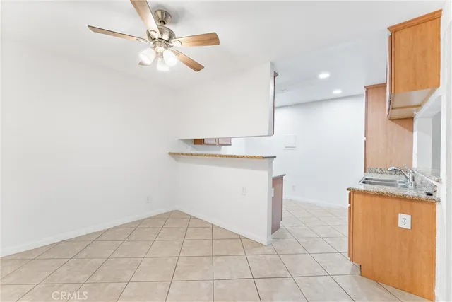 a view of a kitchen with a sink and cabinets