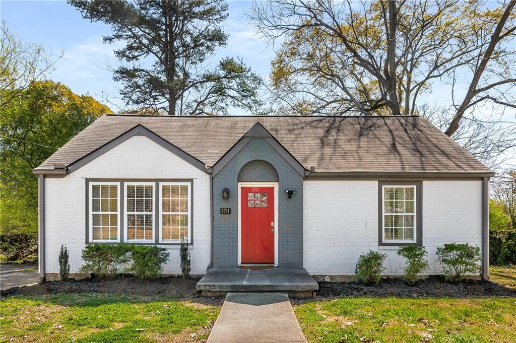 2711 McAfee Road Decatur, GA 30032 - Photo 1 of 1 a front view of house with yard space and swimming pool