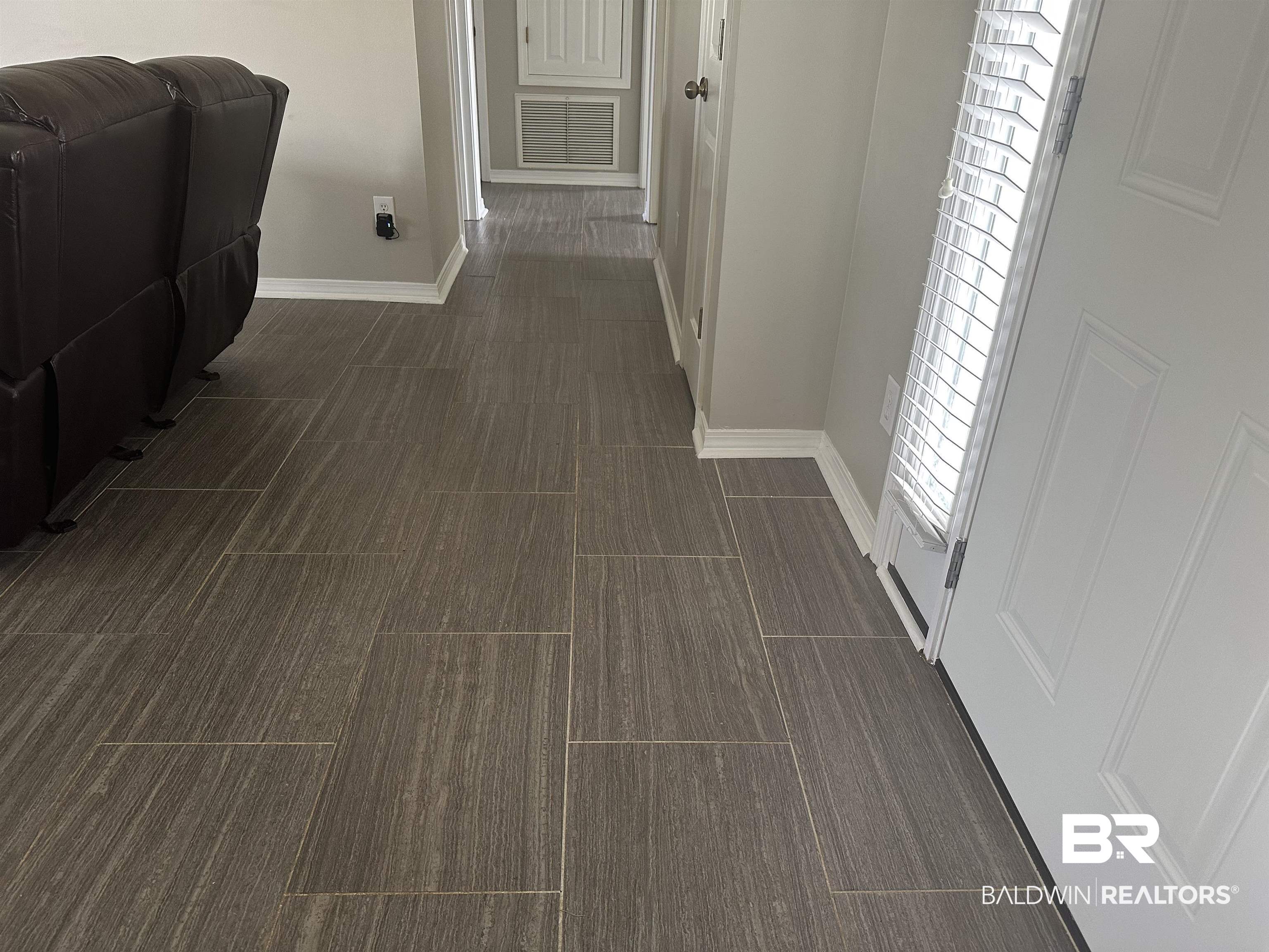 4882 Rebecca Place Mobile, AL 36695 - Photo 22 of 29 Hallway featuring visible vents and baseboards