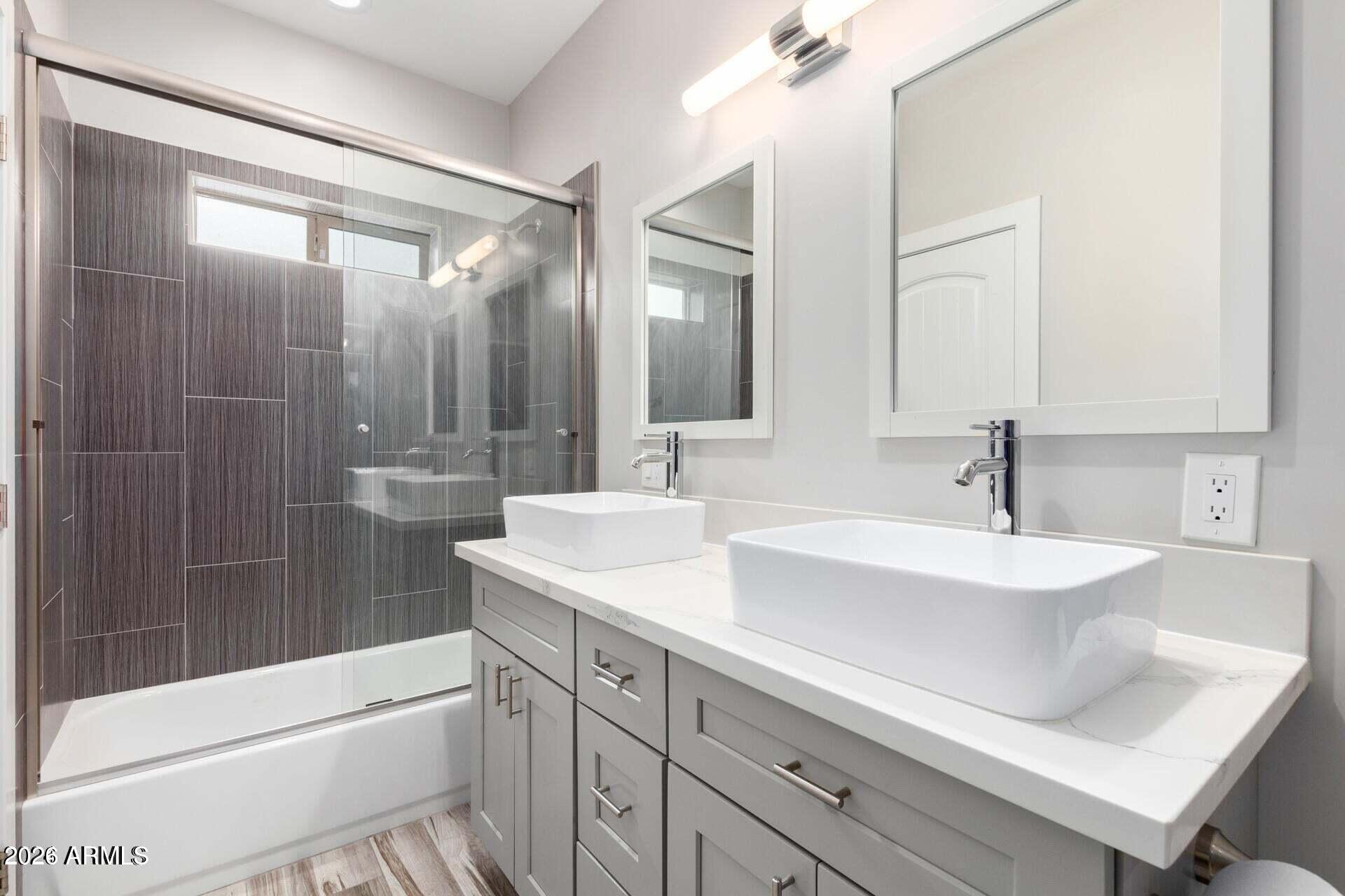 2647 East Contention Mine Road Phoenix, AZ 85032 - Photo 17 of 34 a bathroom with a sink a toilet and shower