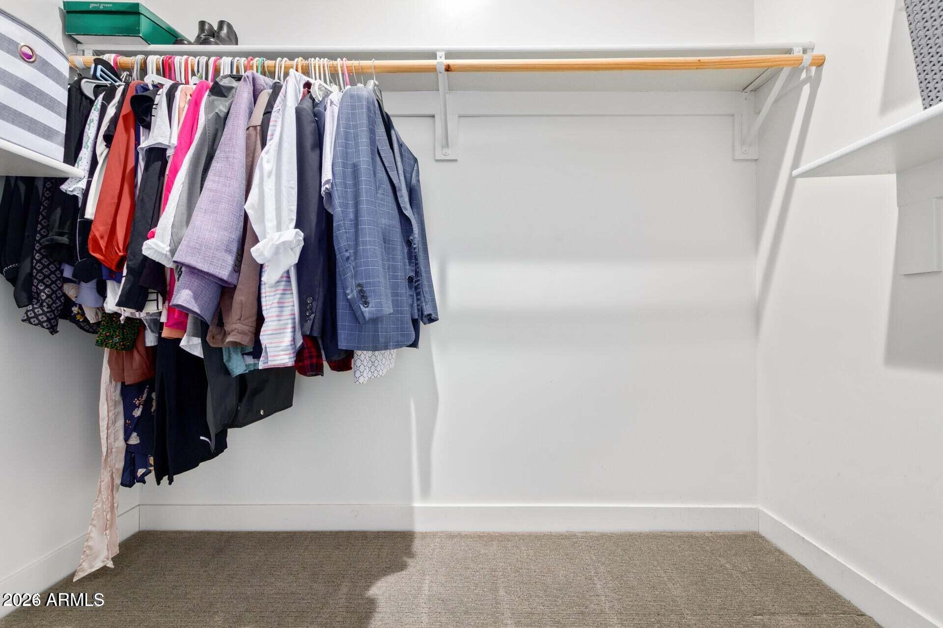 2647 East Contention Mine Road Phoenix, AZ 85032 - Photo 19 of 33 a view of walk in closet with clothes