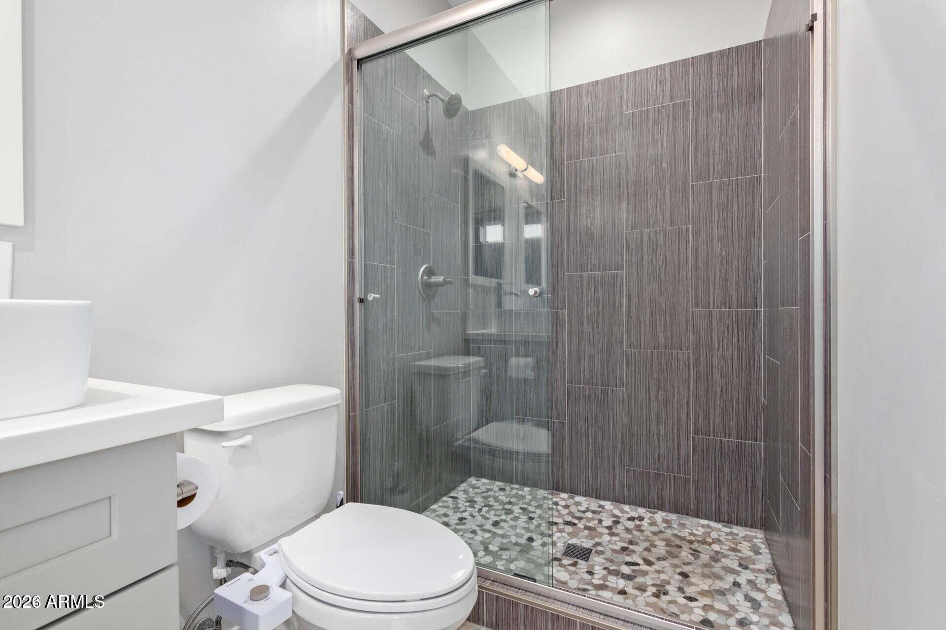 2647 East Contention Mine Road Phoenix, AZ 85032 - Photo 18 of 34 a bathroom with a sink a toilet and shower