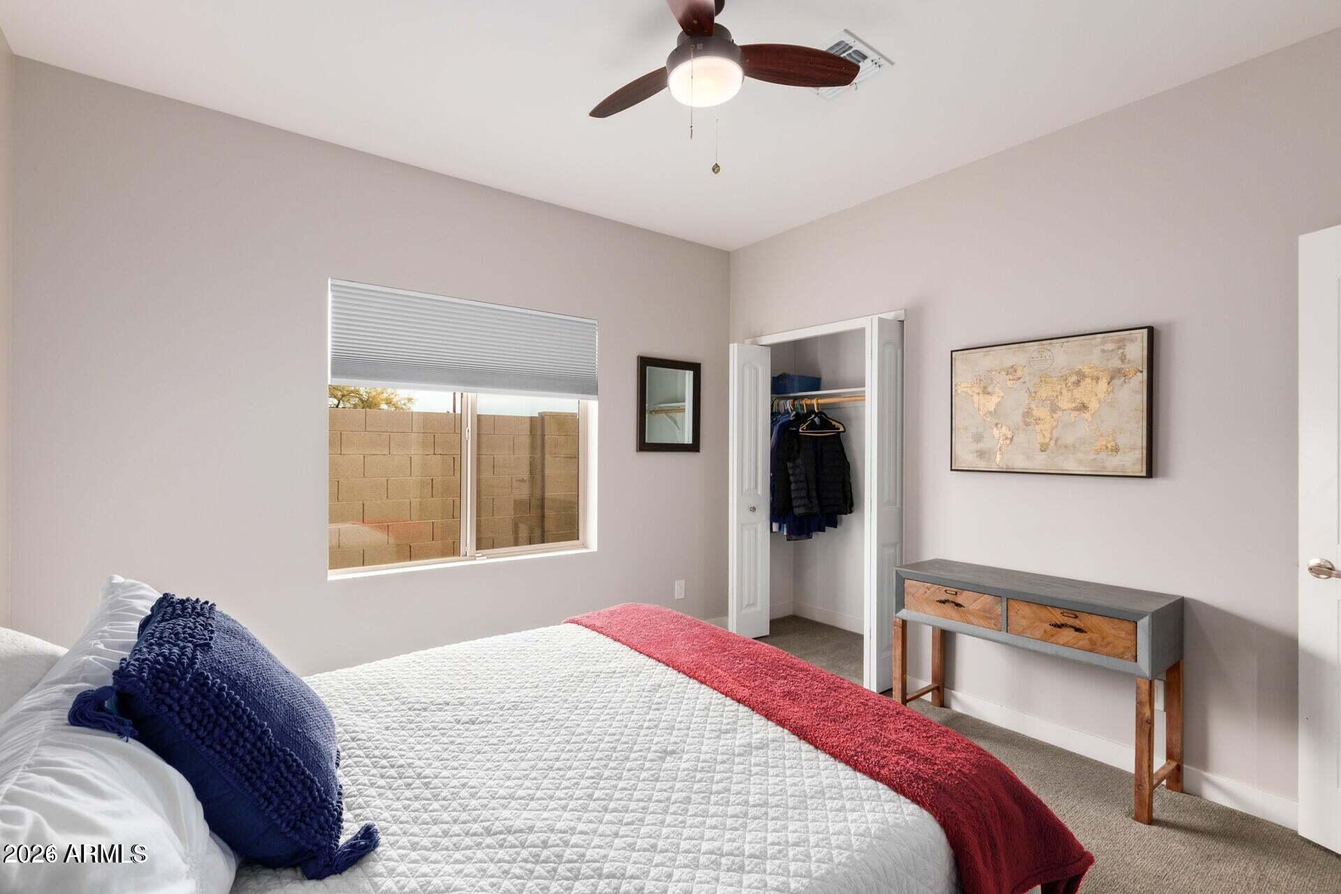 2647 East Contention Mine Road Phoenix, AZ 85032 - Photo 21 of 33 a bedroom with a large bed and a window