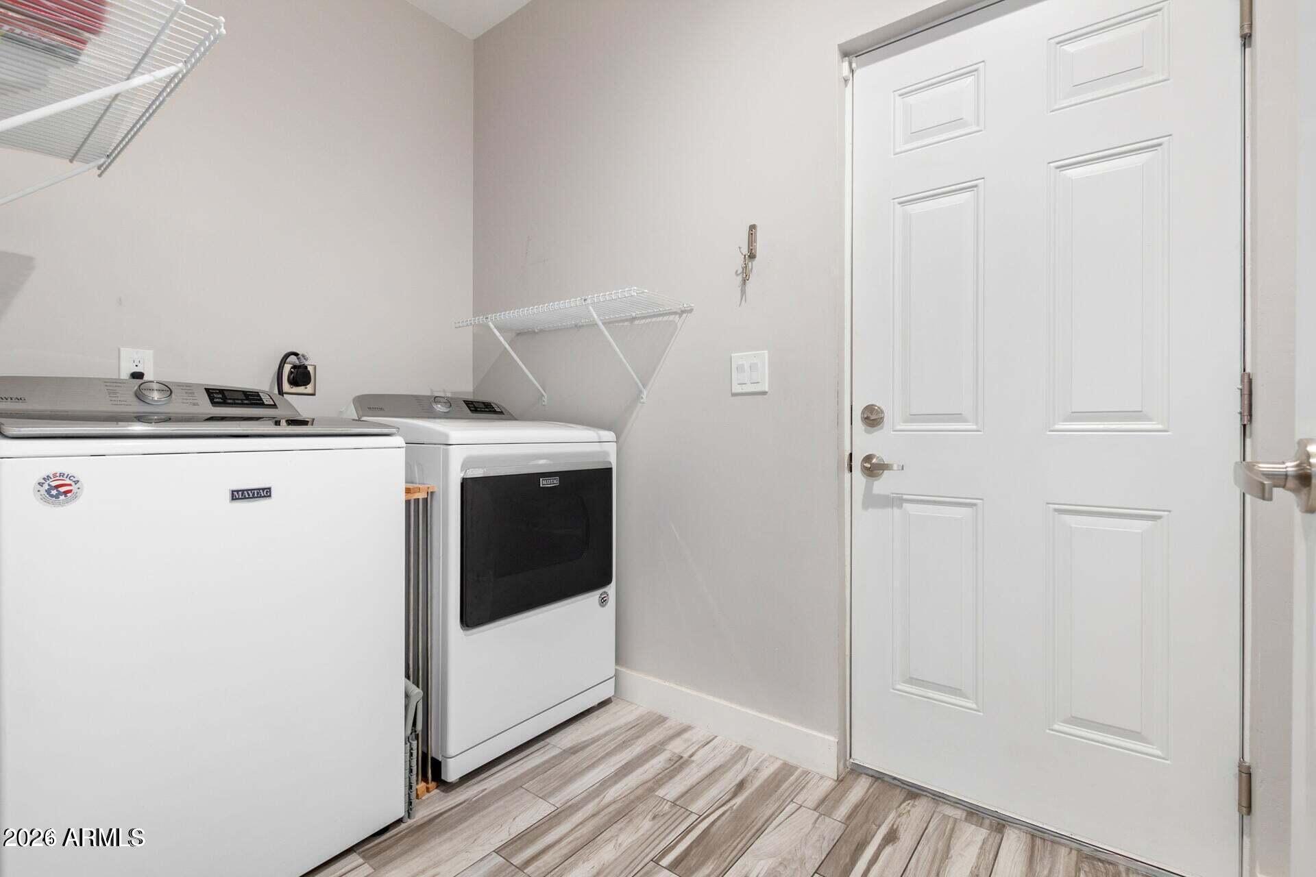 2647 East Contention Mine Road Phoenix, AZ 85032 - Photo 25 of 34 a utility room with cabinets washer and dryer