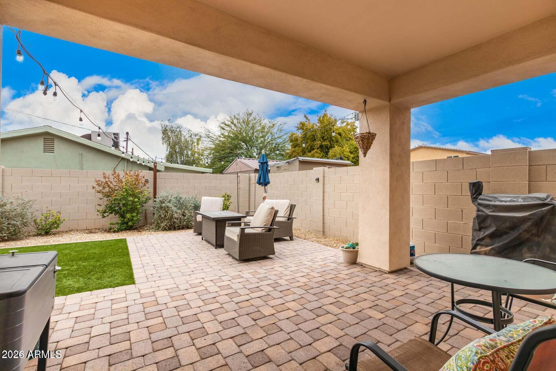 2647 East Contention Mine Road Phoenix, AZ 85032 - Photo 26 of 33 a view of a patio with table and chairs and potted plants