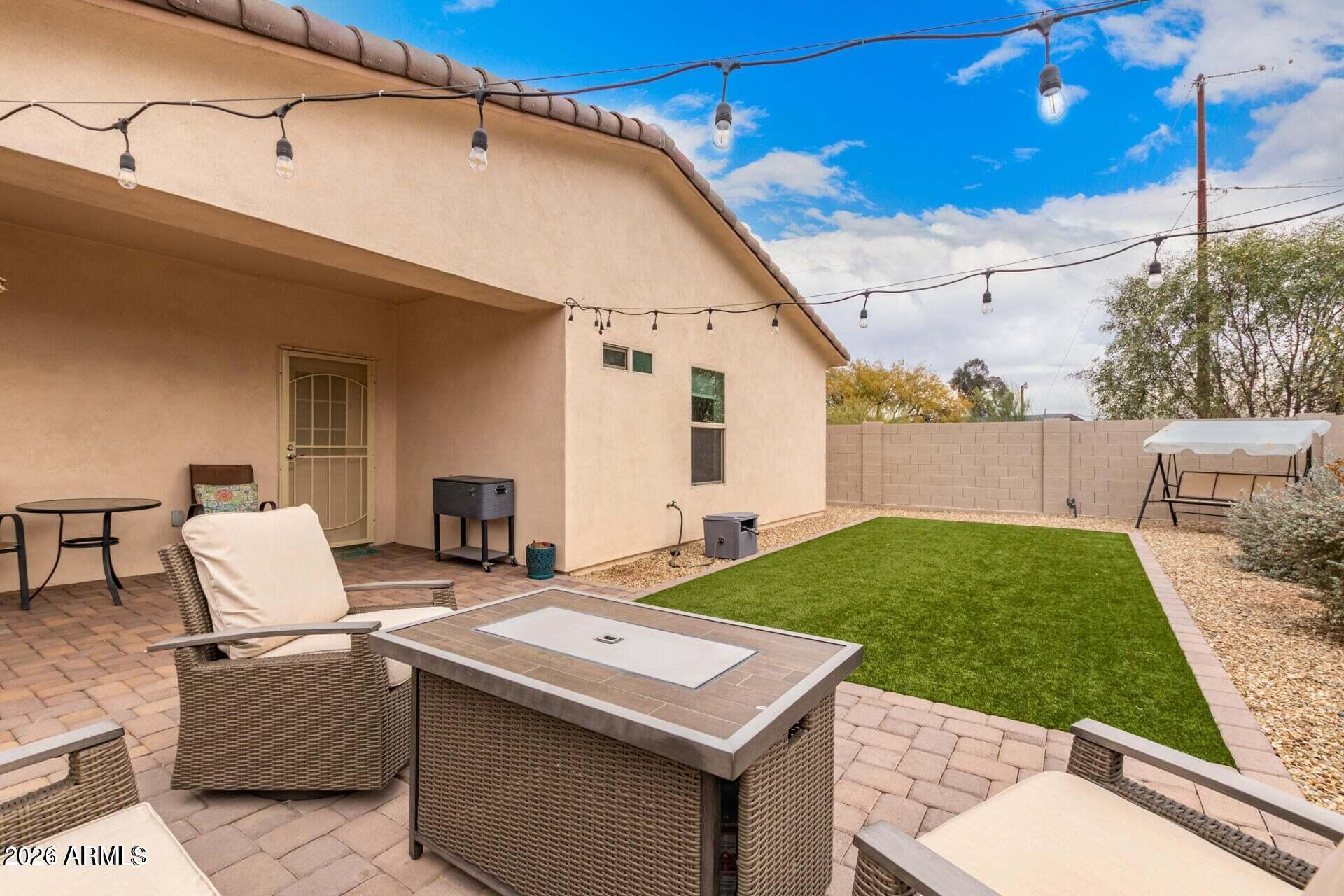 2647 East Contention Mine Road Phoenix, AZ 85032 - Photo 31 of 34 a view of a patio with table and chairs with wooden fence