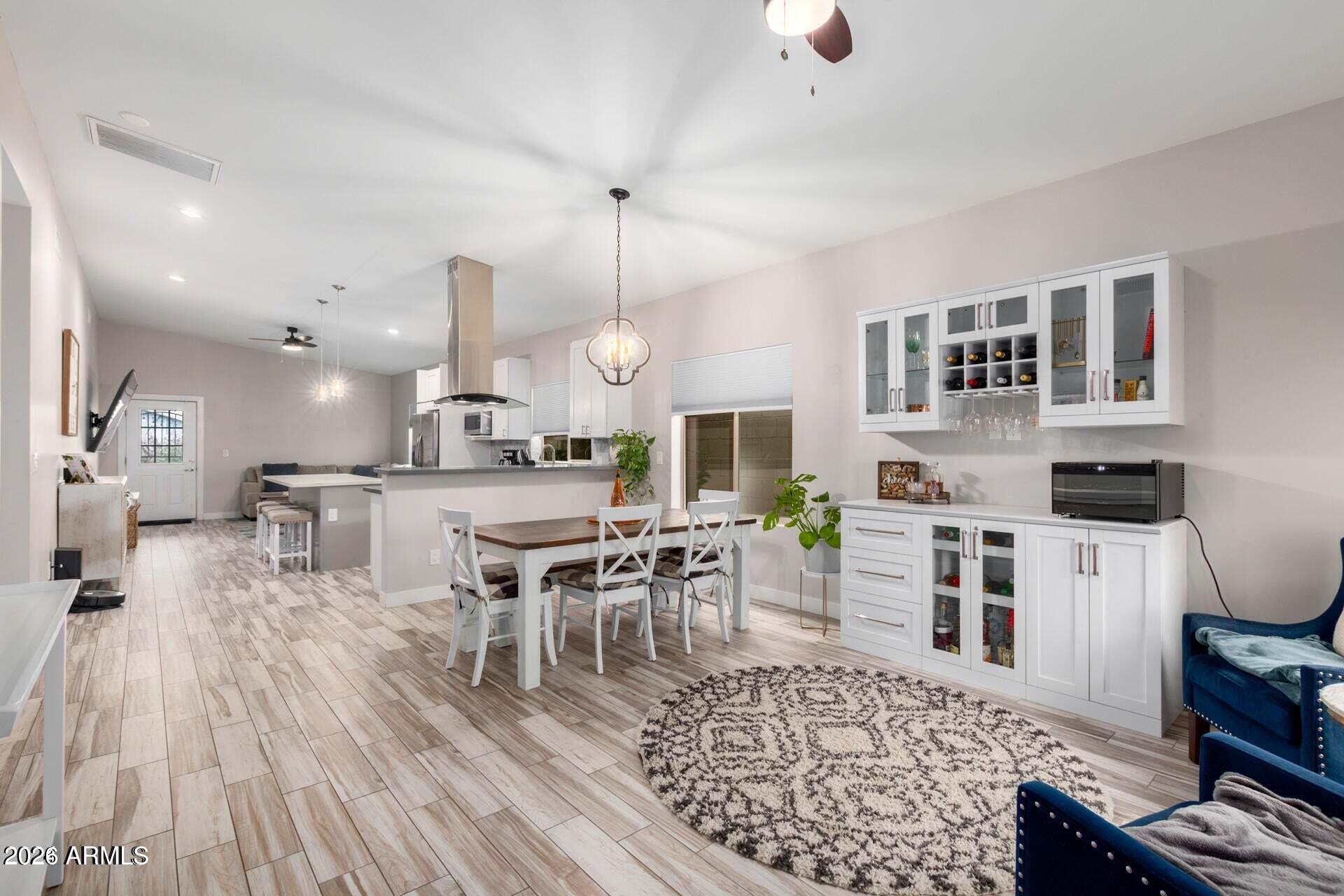 2647 East Contention Mine Road Phoenix, AZ 85032 - Photo 5 of 34 a large kitchen with a table and chairs in it