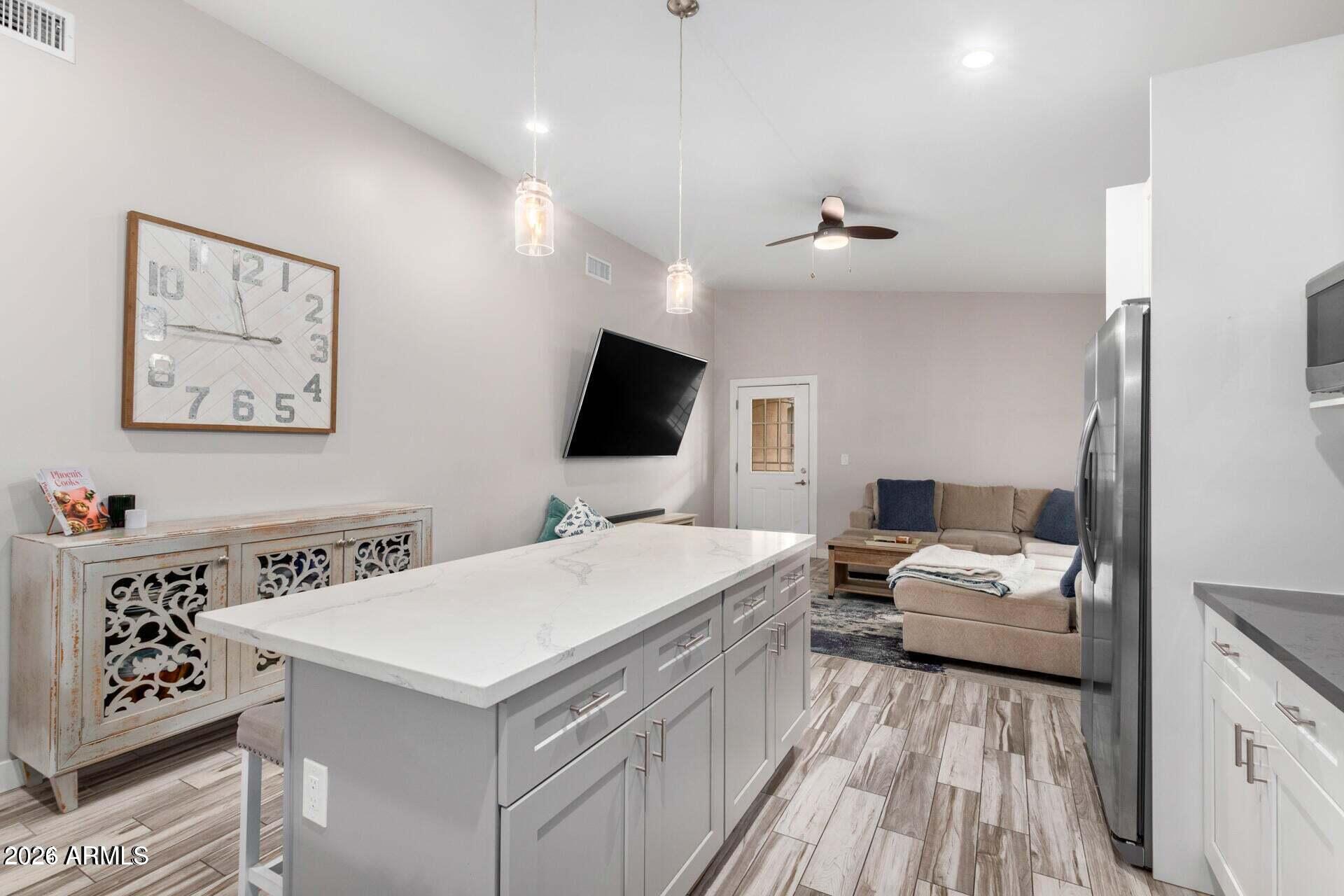 2647 East Contention Mine Road Phoenix, AZ 85032 - Photo 8 of 33 a bedroom with a bed and a flat screen tv