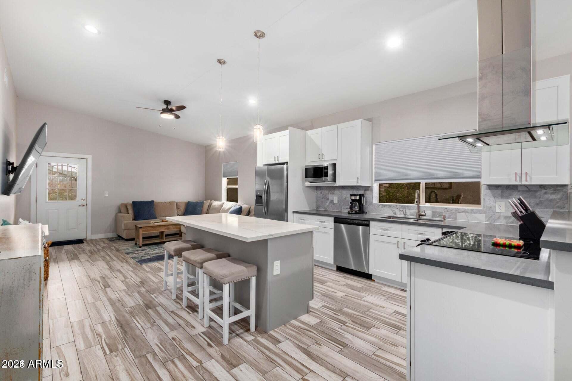 2647 East Contention Mine Road Phoenix, AZ 85032 - Photo 7 of 34 a kitchen with refrigerator and cabinets