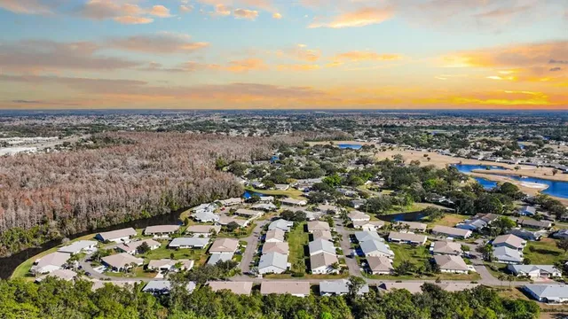 an aerial view of a houses with a swimming pool