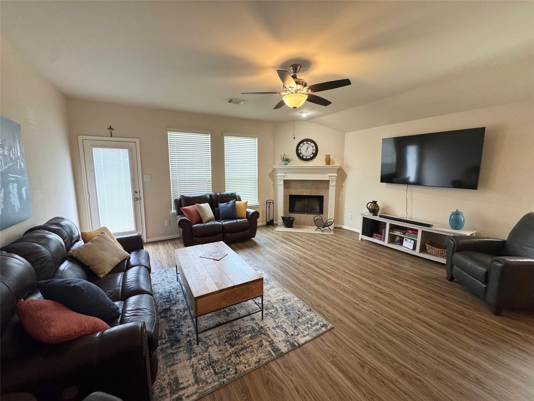 21818 Saragosa Pond Lane Spring, TX 77379 - Photo 5 of 15 The family rooms is very spacious and has recliner seating for eight. All bills are paid: yard service, utilities, and cable. There are four TVs.