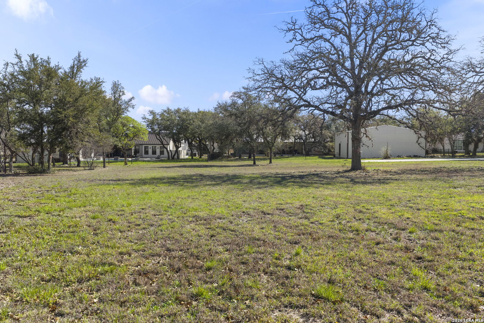 28510 Boerne Stage Road Boerne, TX 78006 - Photo 10 of 24 a large building with trees in the background