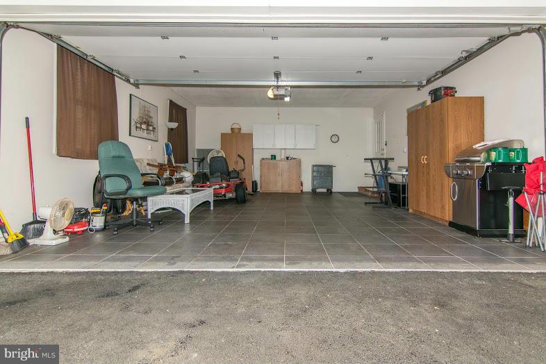 8369 WB&A Road Severn, MD 21144 - Photo 20 of 25 2 Car Garage w/ Tile Floor doubles as THE MAN CAVE