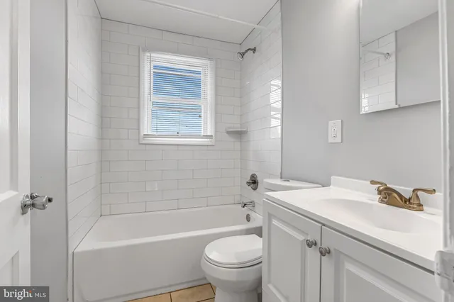 a bathroom with a sink a toilet and a bathtub