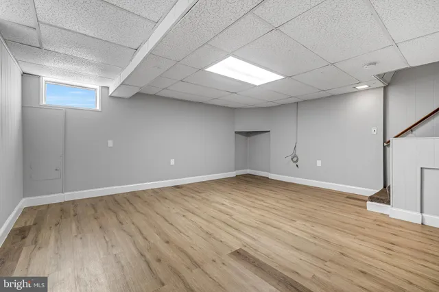 an empty room with wooden floor