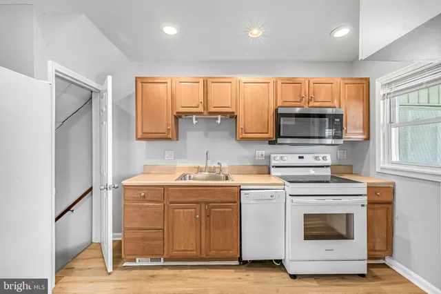 a kitchen with a stove and a microwave