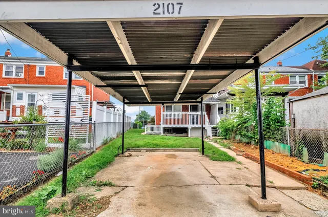 a view of a backyard of the house