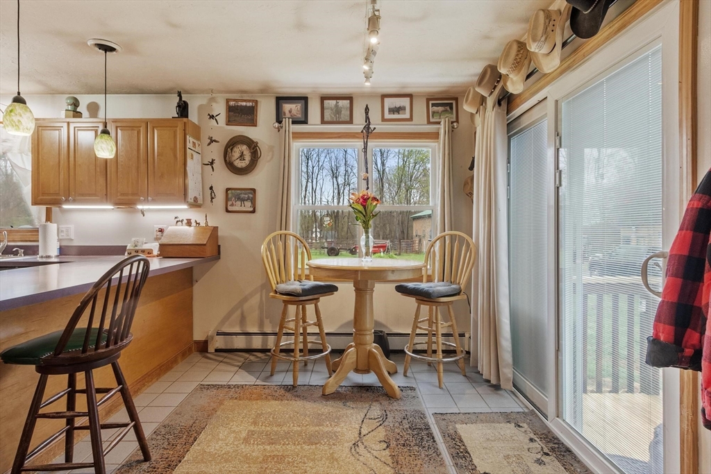 340 Ball Hill Road Princeton, MA 01541 - Photo 25 of 41 a view of a dining room with furniture window and outside view