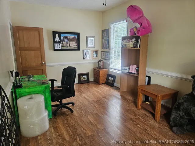 a large bed sitting in a bedroom next to a wooden door