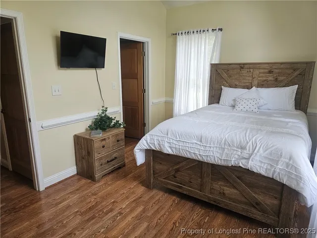 a living room with furniture window and wooden floor