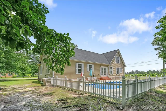 a view of a swimming pool with a lounge chair