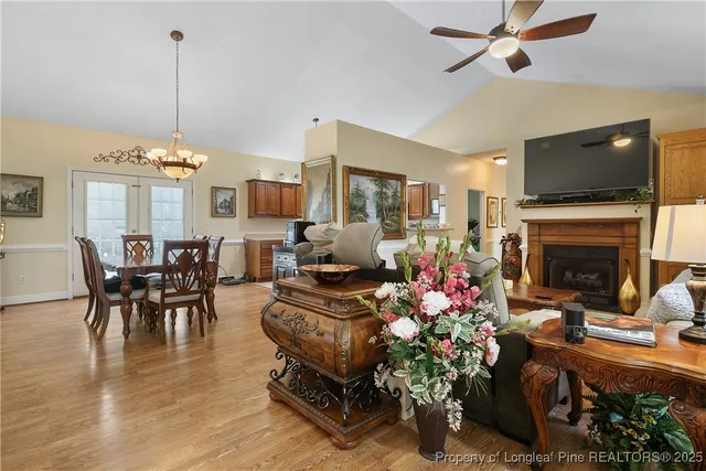 a living room with furniture fireplace and flat screen tv