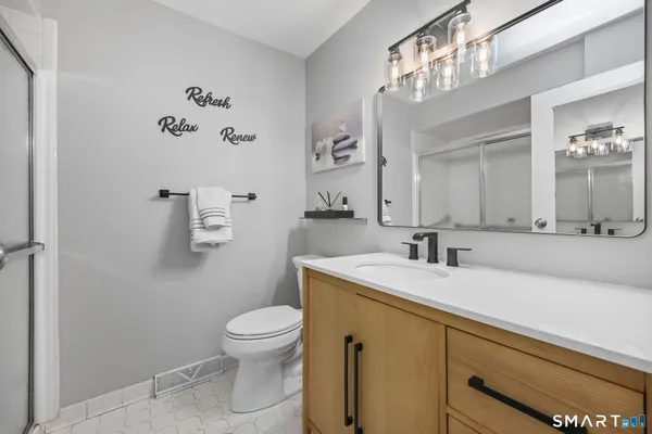 a view of a porch with furniture and a yard