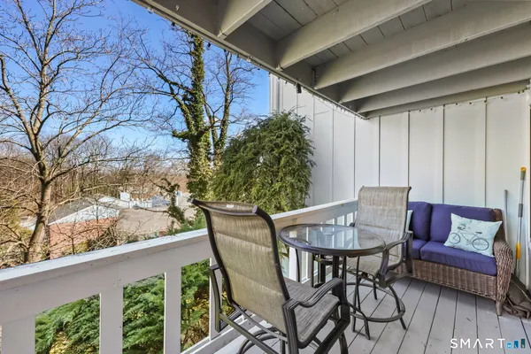 a view of a brick house with plants