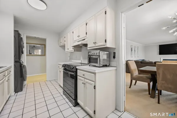 a kitchen with cabinets and steel stainless steel appliances