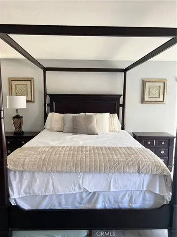 a bedroom with a bed and window