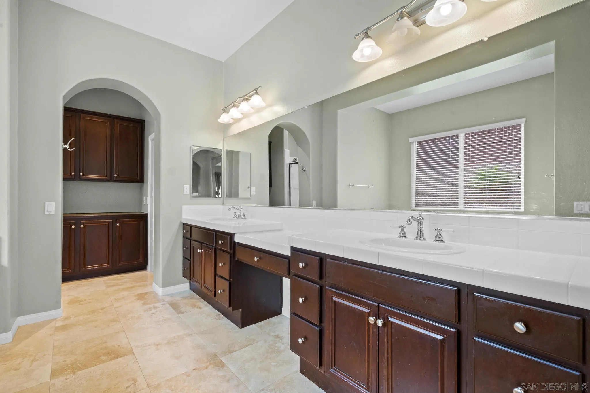 3252 Hidden Estates Lane Escondido, CA 92027 - Photo 15 of 32 a spacious bathroom with a granite countertop double vanity sink and a mirror