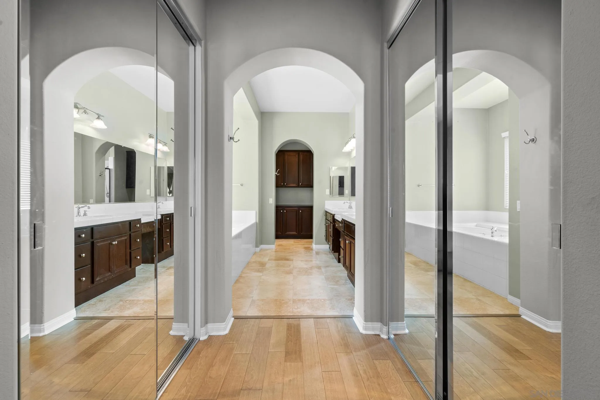 3252 Hidden Estates Lane Escondido, CA 92027 - Photo 16 of 32 a view of a hallway with bathroom and glass door