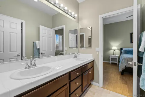 a bathroom with a sink double vanity and a mirror