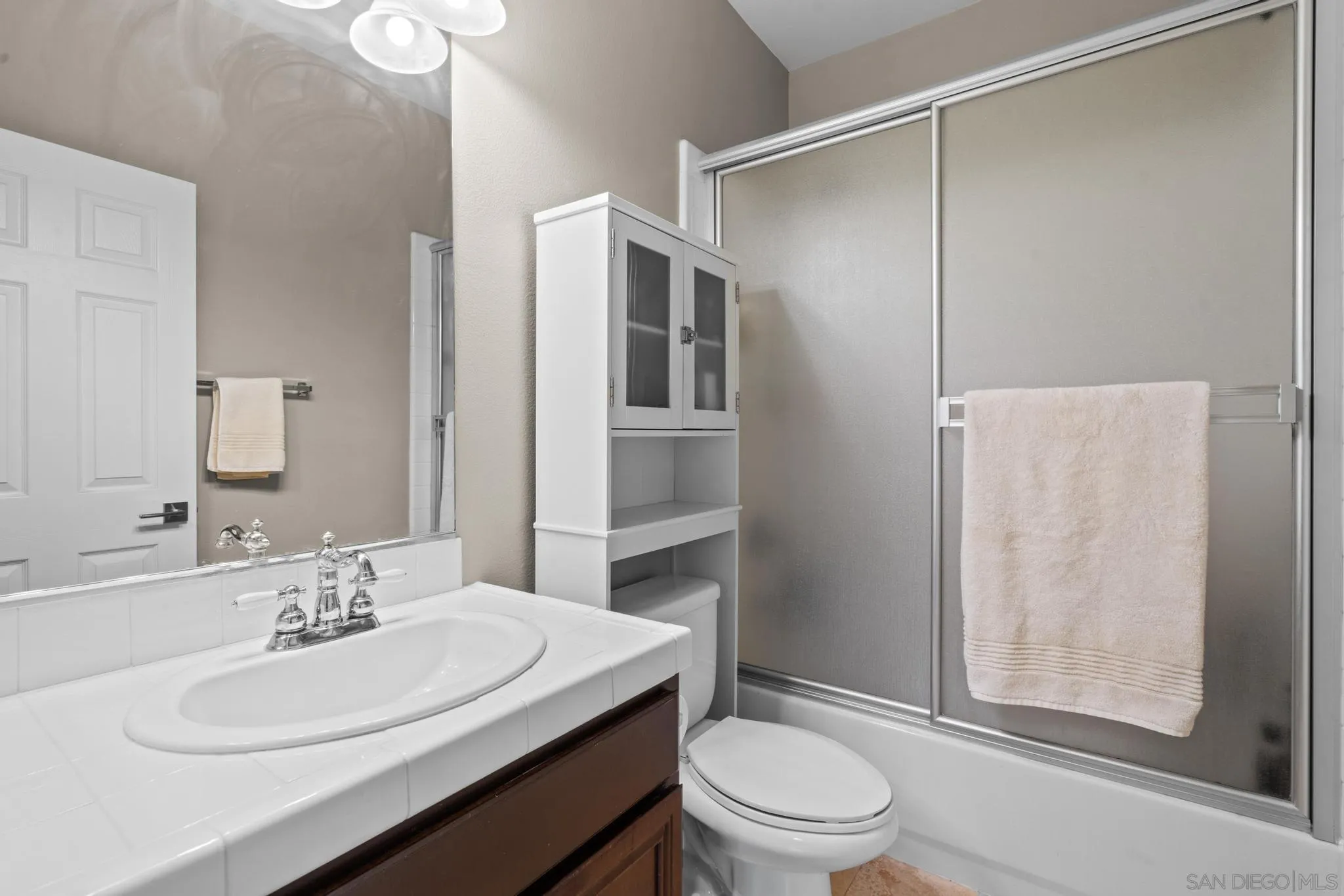 3252 Hidden Estates Lane Escondido, CA 92027 - Photo 21 of 32 a bathroom with a sink a toilet and shower