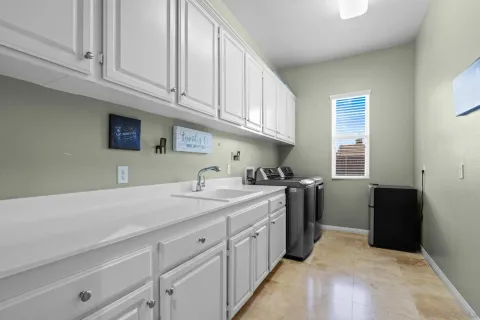 a kitchen with a sink and cabinets