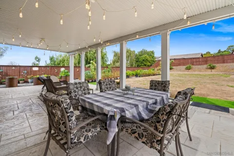 a view of a patio with furniture and outside view