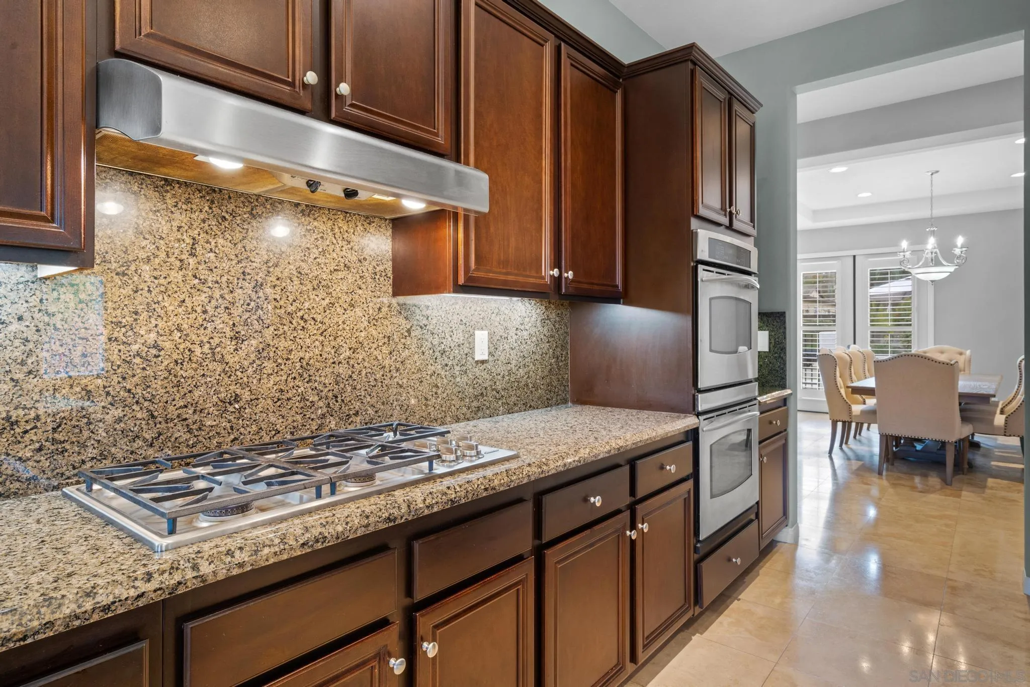 3252 Hidden Estates Lane Escondido, CA 92027 - Photo 9 of 32 a kitchen with granite countertop a sink stove and cabinets
