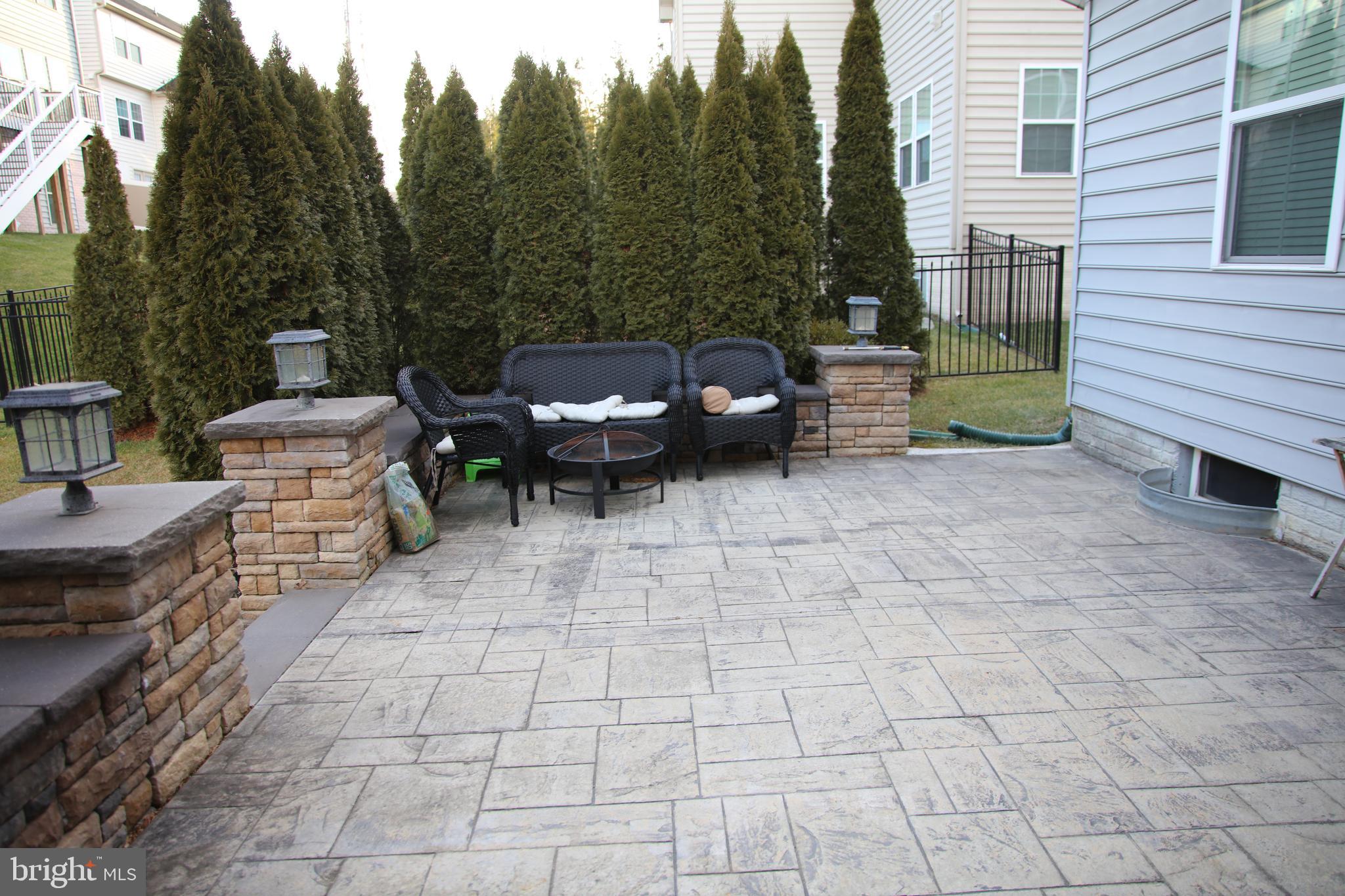 10431 Windlass Run Road Baltimore, MD 21220 - Photo 15 of 16 a view of a patio with table and chairs with wooden floor and fence