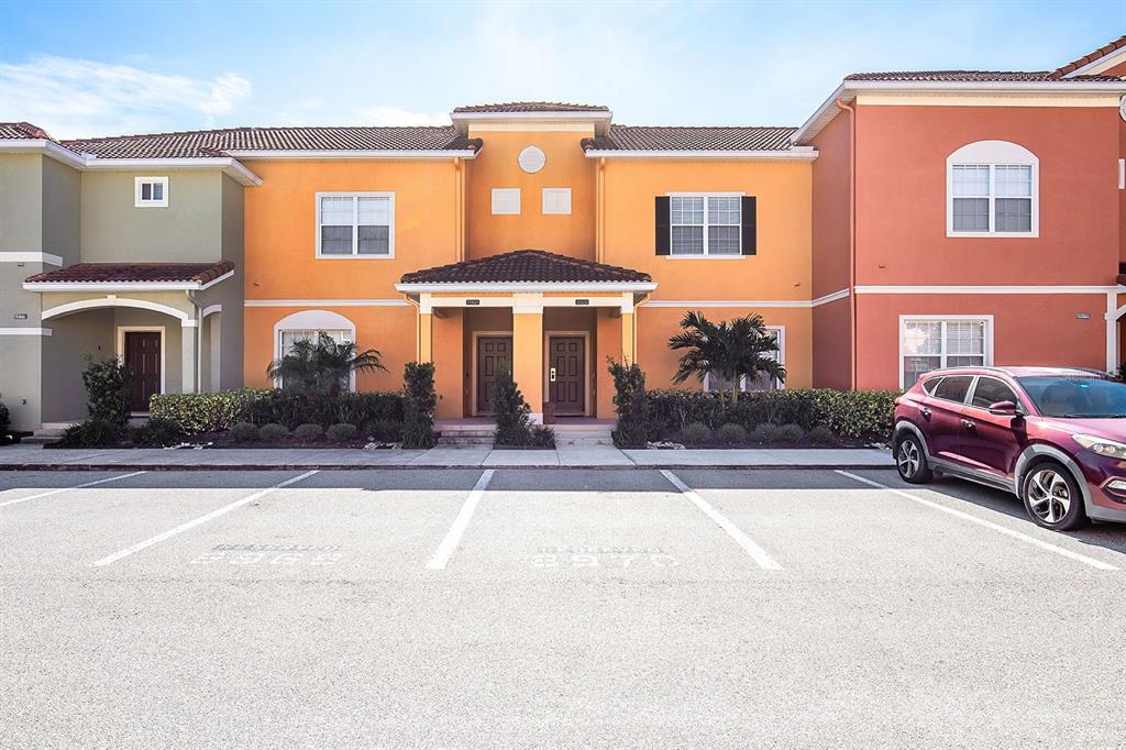 8970 Candy Palm Road Kissimmee, FL 34747 - Photo 1 of 1 a front view of a house with a garden