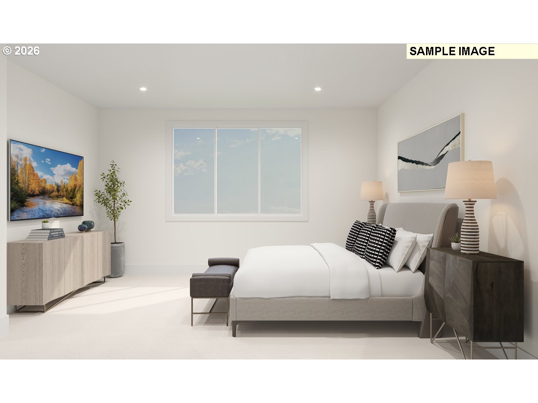 3807 South 16th Way, Unit L28 Ridgefield, WA 98642 - Photo 7 of 12 a bedroom with a bed and a flat screen tv