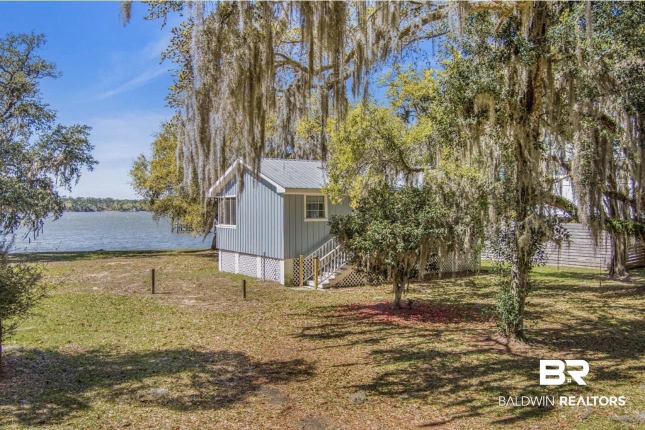 11326 County Road 26 Foley, AL 36535 - Photo 5 of 20 View of grassy yard featuring a water view and stairs