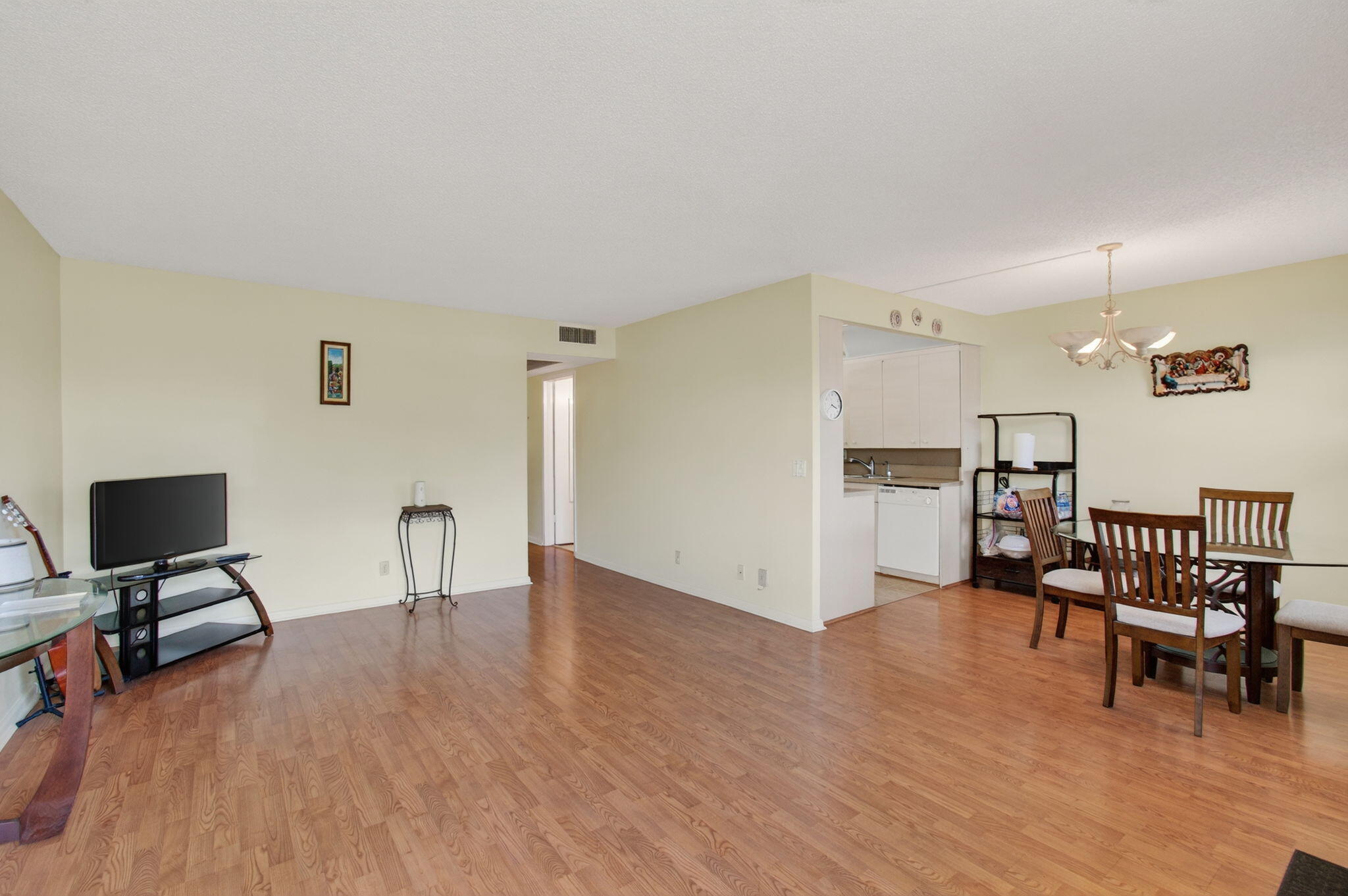 a view of a livingroom with furniture and a workspace